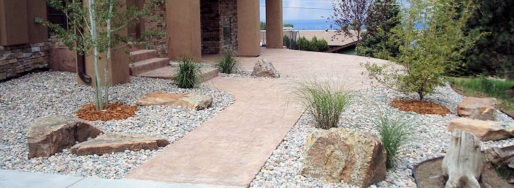 Stone path leading to front door with xeriscaping on either side