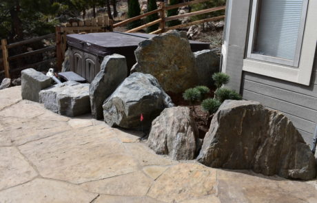 Large stones next to hot tub near house in Boulder, CO