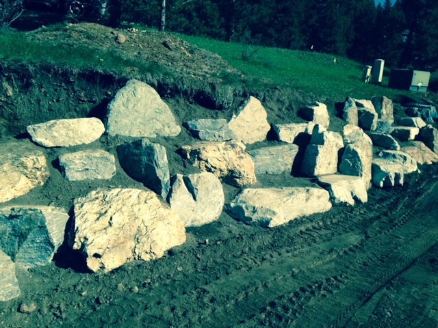 Large boulder field installed at house