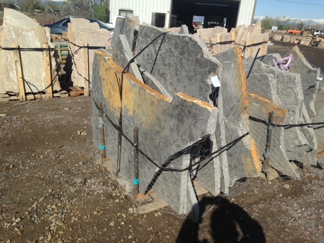 Thick gray flagstone at quarry, strapped together
