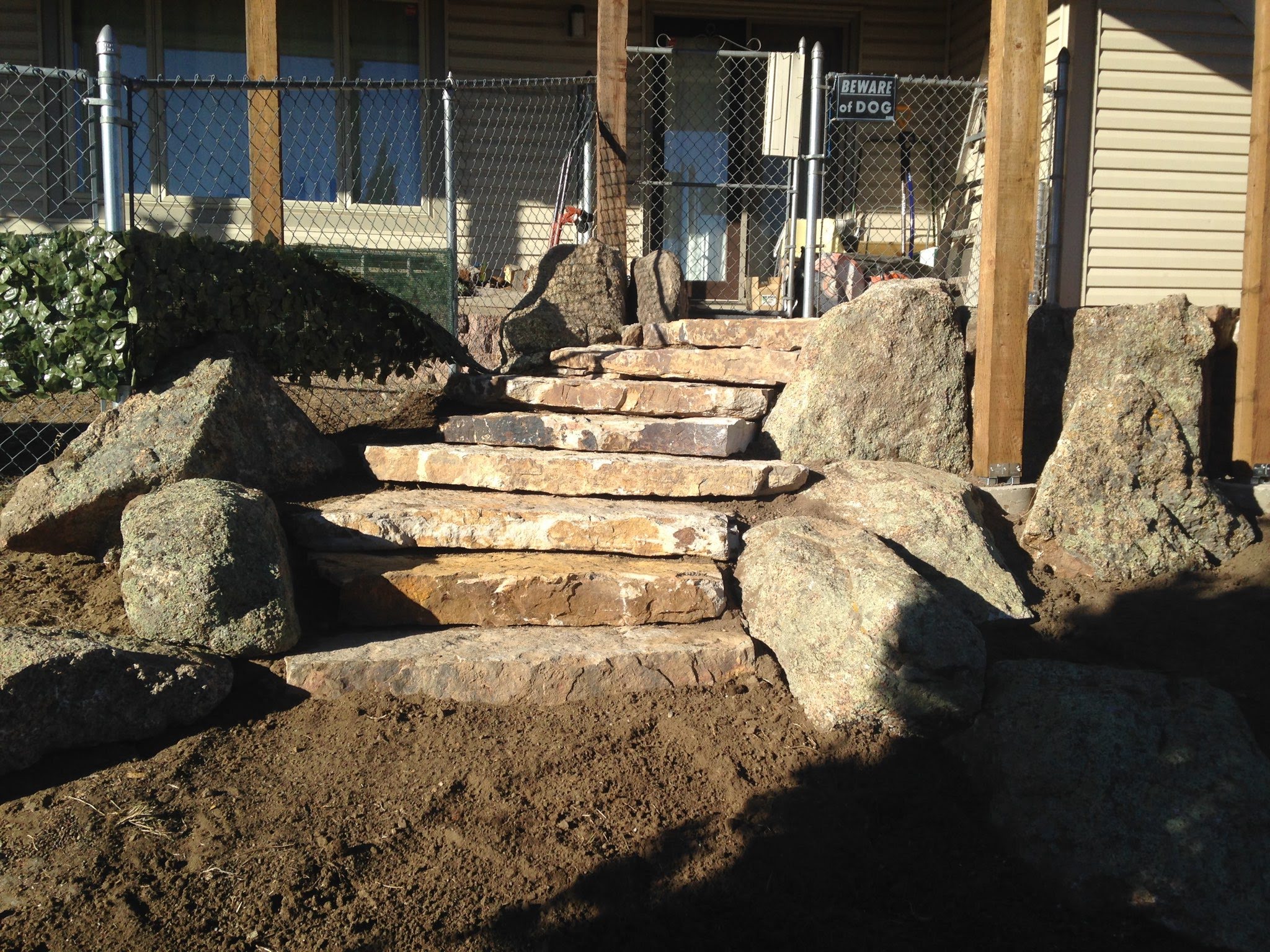 Small stone staircase leading to front door