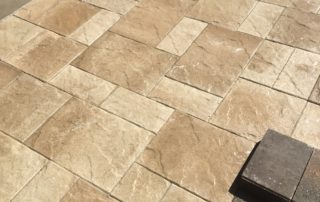 Mosaic of tan pavers for an outdoor pation