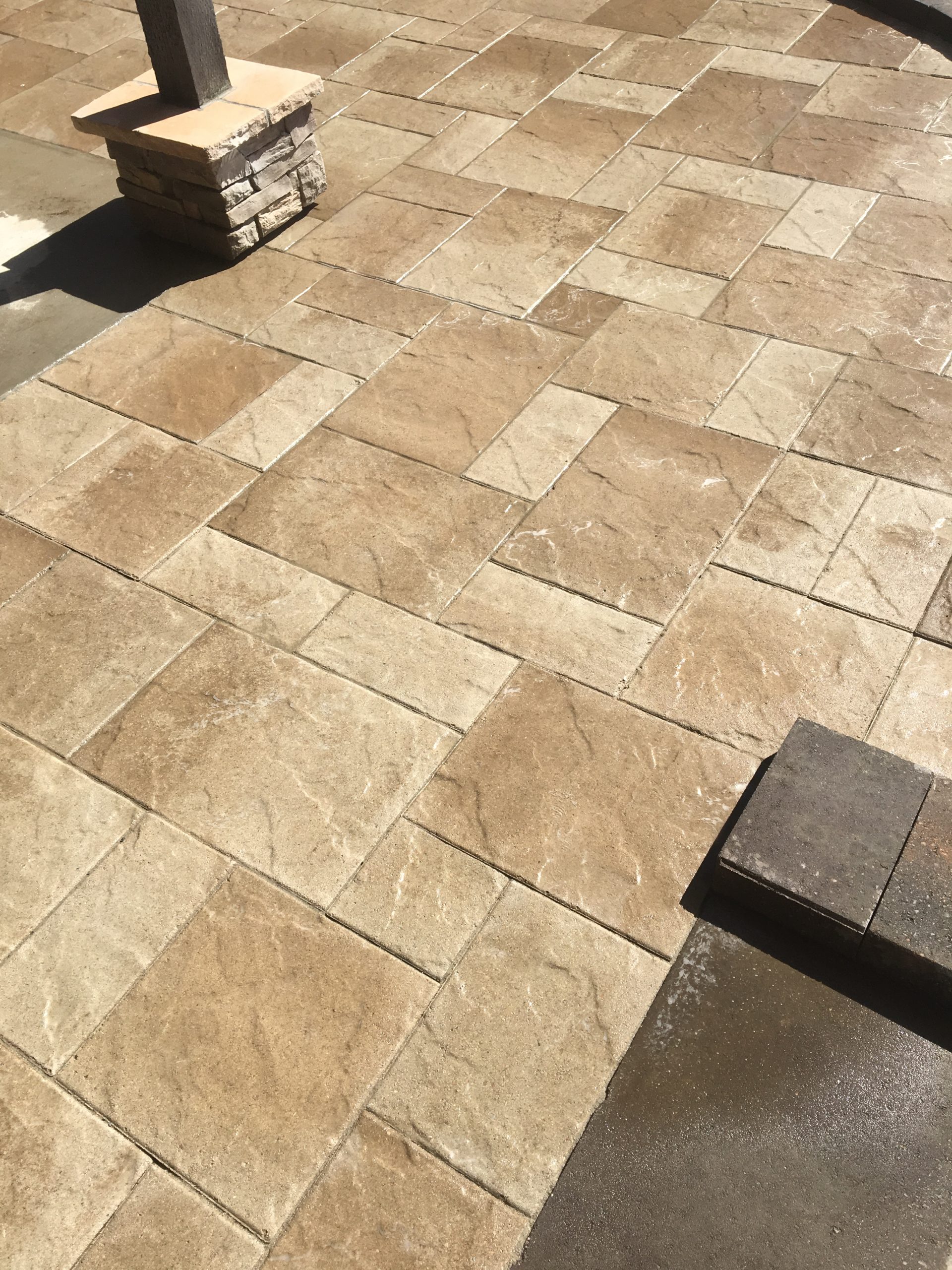 Mosaic of tan pavers for an outdoor pation
