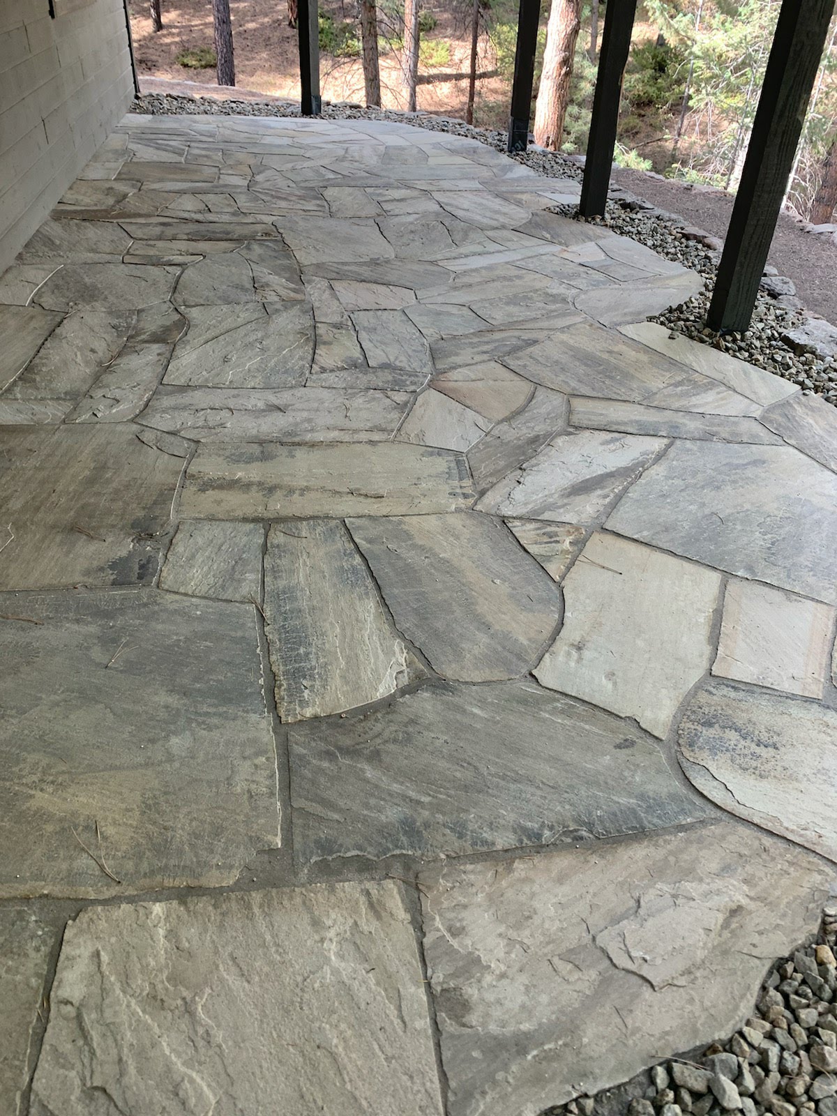 Finished patio made of gray flagstone