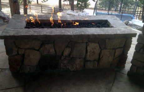 Gas fireplace trough, surrounded by stone